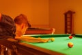 Playing in billiard pool activity.