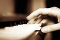 The hand presses the keys of the synthesizer, selective focus, depth of fields Royalty Free Stock Photo