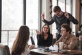 Playing office game. Having fun in the office room. Friendly coworkers playing around and celebrating success Royalty Free Stock Photo