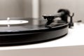 Playing an old vinyl. Dust on the turntable. Needle close-up Royalty Free Stock Photo