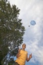 Playing with parachute toy vertical Royalty Free Stock Photo