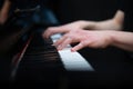 Playing the piano on a black background