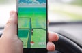 Playing Pokemon Go while driving Royalty Free Stock Photo