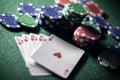 Playing poker in a casino holding winning royal flush hand of cards Royalty Free Stock Photo