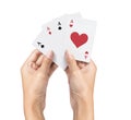 playing poker Deck of Ace High Royal Flush Cards in pretty women hand isolated on white background. Royalty Free Stock Photo