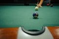 Playing pool in a night pub Royalty Free Stock Photo