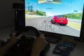 Playing racing video game at home