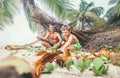 Playing in Robinzones: father and son built a hut from palm tree Royalty Free Stock Photo