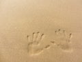 Playing with sand long the shoreline