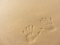 Playing with sand long the shoreline