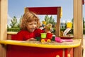Playing with sand on playground Royalty Free Stock Photo