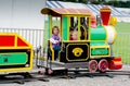 Playing in a small train at an outdoor festival