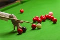 Playing snooker - man aiming the cue ball Royalty Free Stock Photo