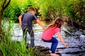 Playing by a Stream Royalty Free Stock Photo