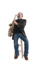 Playing a tenor sax seated on a stool Royalty Free Stock Photo