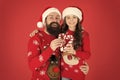 Playing together. Santa claus family look. Bearded dad and little girl. Christmas games. Joy and happiness. Christmas