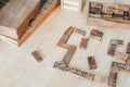 Playing traditional wooden domino game on wooden table background.Family board game, Game night vintage dominos in a row on old ru Royalty Free Stock Photo