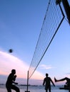 Playing volleyball at sunset