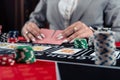 Playing woman poker and gambling in casino, spending time in games of chance Royalty Free Stock Photo