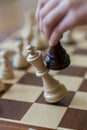 Playing wooden chess pieces. Chess game. The fall of the king. Vertical photo Royalty Free Stock Photo