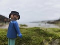 Playmobil figure on the beach looking at camera Royalty Free Stock Photo