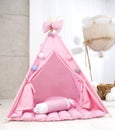 Playroom with Teepee. Modern room interior with play tent for child. pink wigwam
