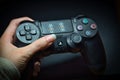 PlayStation controller held in hand