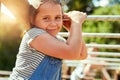 Playtime is the best time. Portrait of a little girl playing on the jungle gym at the park. Royalty Free Stock Photo