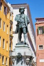 Playwright Carlo Goldoni statue with pedestal by Antonio Dal Zotto (1841-1918) in Venice in a sunny day, Italy