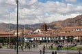 The Plaza de Armas center square with fountain with Peruvians and tourists going about their day in Cusco, Peru Royalty Free Stock Photo