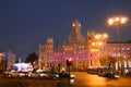 The Plaza de Cibeles at the intersection between Recoletos street and Alcala street, illuminated at sunset. Royalty Free Stock Photo