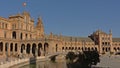 Historical builddings, archway and canal with bridgee on Plaza Espana, Seville