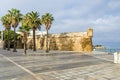 Plaza de Filipinas with a man fishing in the Bay of Cadiz, Spain