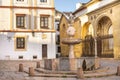 Plaza del Potro with a fountain crowned with a foal and a coat of arms in the Old Town Cordoba, Andalusia, Spain