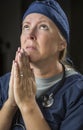 Pleading in Prayer Female Doctor or Nurse Royalty Free Stock Photo