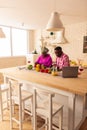 Pleasant African couple cooking their traditional food