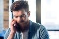 Pleasant bearded man using cell phone Royalty Free Stock Photo