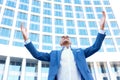 Pleasant businessman standing near office Royalty Free Stock Photo