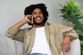 Pleasant Call. Happy Smiling African American Man Talking On Cellphone At Home Royalty Free Stock Photo