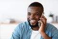 Pleasant Call. Positive Millennial Black Man Talking On Mobile Phone And Smiling Royalty Free Stock Photo