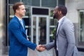 Pleasant colleagues shaking hands Royalty Free Stock Photo