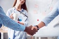 Pleasant colleagues shaking hands Royalty Free Stock Photo