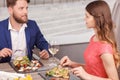 Pleasant couple during date in restaurant