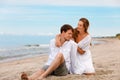 Pleasant couple of sweethearts resting on the beach Royalty Free Stock Photo