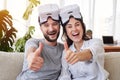 Pleasant couple in VR goggles showing thumbs up