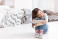 Pleasant cute girl sitting on the floor