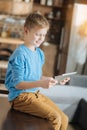 Pleasant delighted boy resting at home Royalty Free Stock Photo