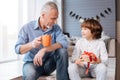 Pleasant delighted child looking at his grandfather Royalty Free Stock Photo