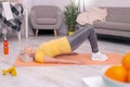 Pleasant elderly woman performing pelvic lift exercise