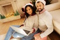 Lovely couple watching movie on laptop on Christmas Royalty Free Stock Photo